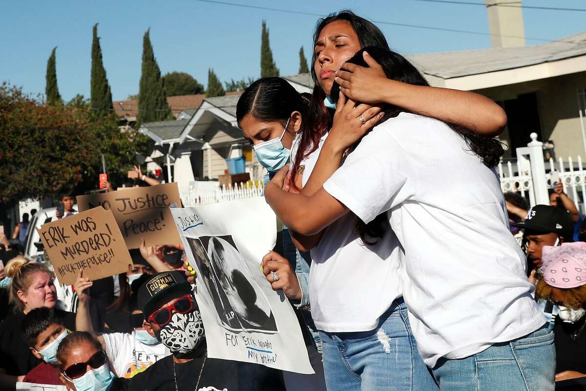 Near the scene of his death, Amanda Majail-Blanco hugs her sister Vanessa after a march to memorialize her stepbrother Erik Salgado, who was killed in a CHP officer-involved shooting Saturday night. Photographed on Cherry Street in Oakland, Calif., on Monday, June 8, 2020.