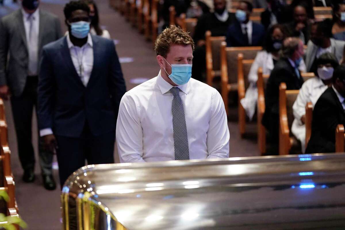 Houston Texans NFL player JJ Watt, pauses by the casket of George Floyd during a funeral service for Floyd at The Fountain of Praise church Tuesday, June 9, 2020, in Houston.