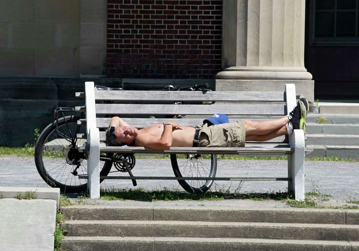 Pat Correa of Saratoga Springs takes a break from riding his bike to work on his tan in Saratoga Spa State Park on Tuesday, June 9, 2020 in Saratoga Springs, N.Y. (Lori Van Buren/Times Union)
