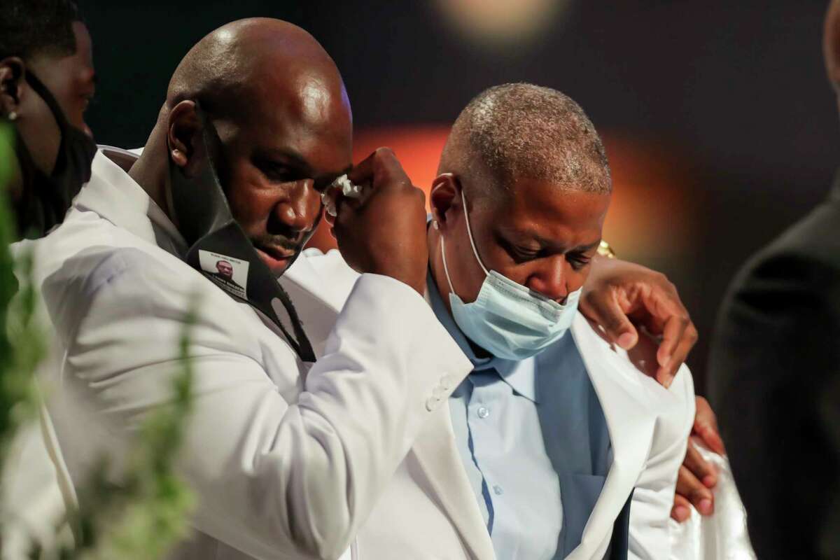 Philonise Floyd puts his arm around his sister LaTonya Floyd as the family speaks during the funeral for George Floyd on Tuesday, June 9, 2020, at The Fountain of Praise church in Houston. Floyd died after being restrained by Minneapolis Police officers on May 25.