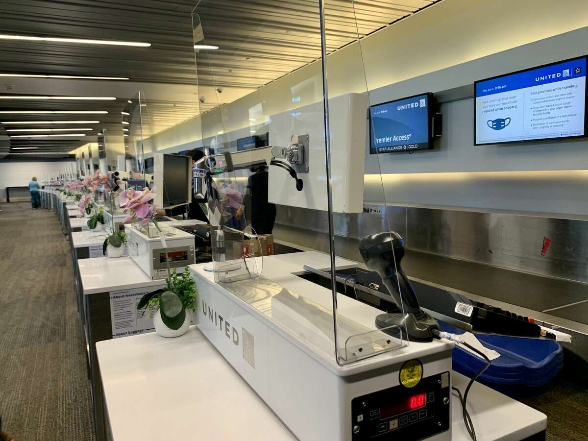 If you need to interact with an agent at the airport, you’ll most likely be speaking from behind plastic barriers. United Airlines has installed see-through guards at agent desks (seen in this photo) made by technicians at the carrier’s San Francisco maintenance base. 