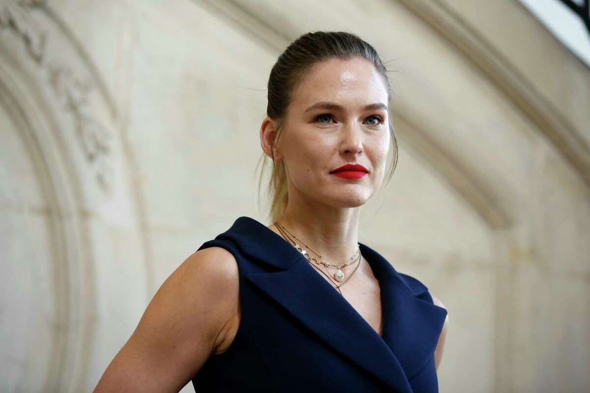 FILE - In this Feb. 26, 2019 file photo, Israeli top model Bar Refaeli poses for photographers at the Dior ready to wear Fall-Winter 2019-2020 collection, in Paris. Refaeli has signed a plea bargain agreement with authorities to settle a long-standing tax evasion case against her and her family. The deal will require Refaeli to serve nine months of community service while her mother will be sent to prison for 16 months. The two are also ordered to pay a $1.5 million fine on top of millions of back taxes owed to the state. (AP Photo/Thibault Camus, File)