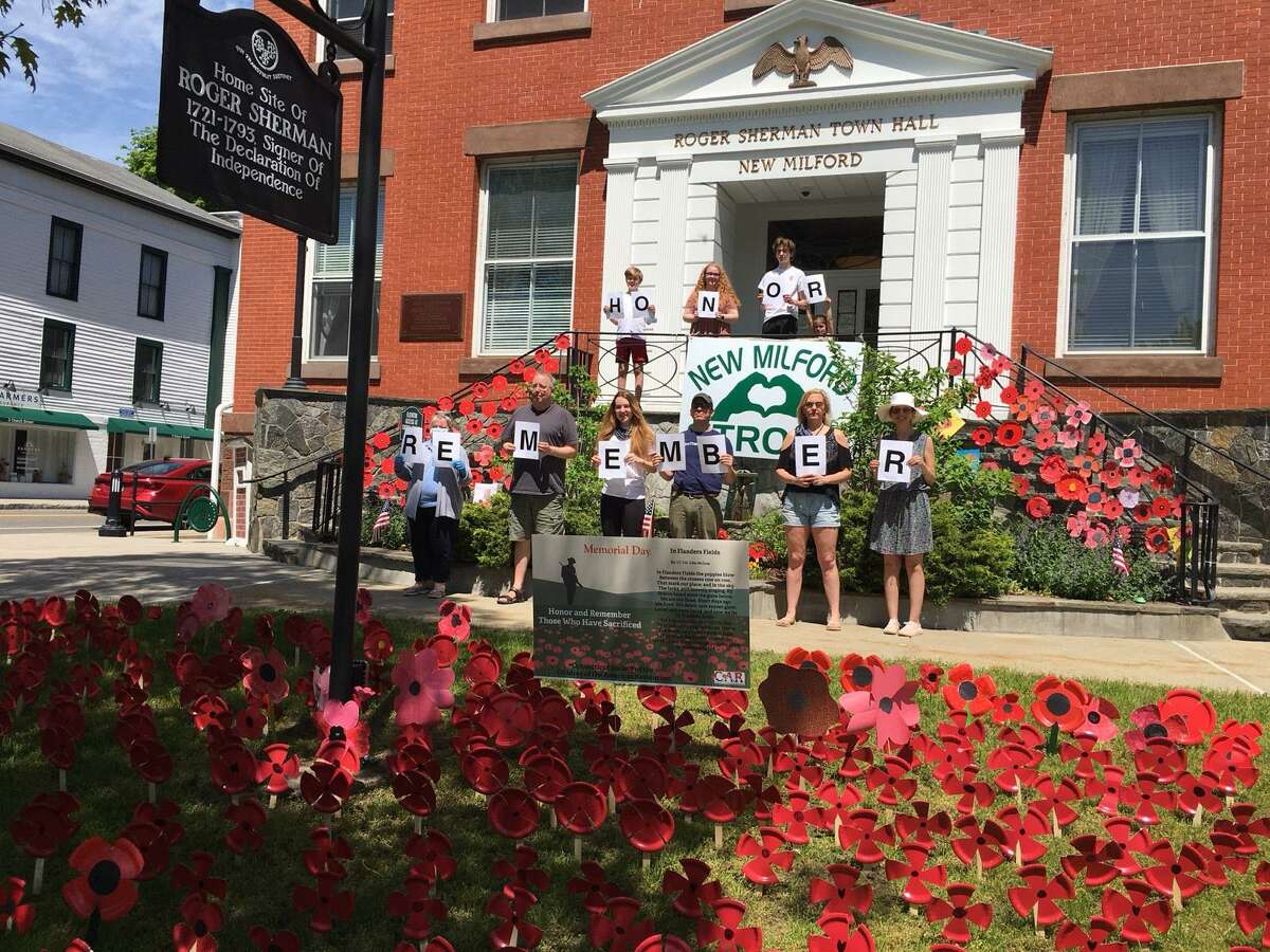 The Charlies Merriman Society, Connecticut Society Children of the American Revolution and the Roger Sherman Chapter, National Society Daughters of the American Revolution recently spearheaded a project to place homemade poppies outside Roger Sherman Town Hall in New Milford for Memorial Day. More than 350 poppies were created by children in the community and CAR members. Poppies were also placed around the war memorials on the Village Green. Above, members of CAR and DAR proudly stand in front of town hall after placing the poppies. They are, from left to right, in back, Jackson Delmore, Sydney Greenlaw, Ryan Delmore and Mary Rehnberg, and in front, Bonnie Butler, Scott Greenlaw, Alexis Delmore, Christopher Rehnberg, Metta Desmarais and Stephanie Rehnberg. Missing are Jon Delmore, Heidi Norcross and Jennie May Rehnberg, Senior State President.