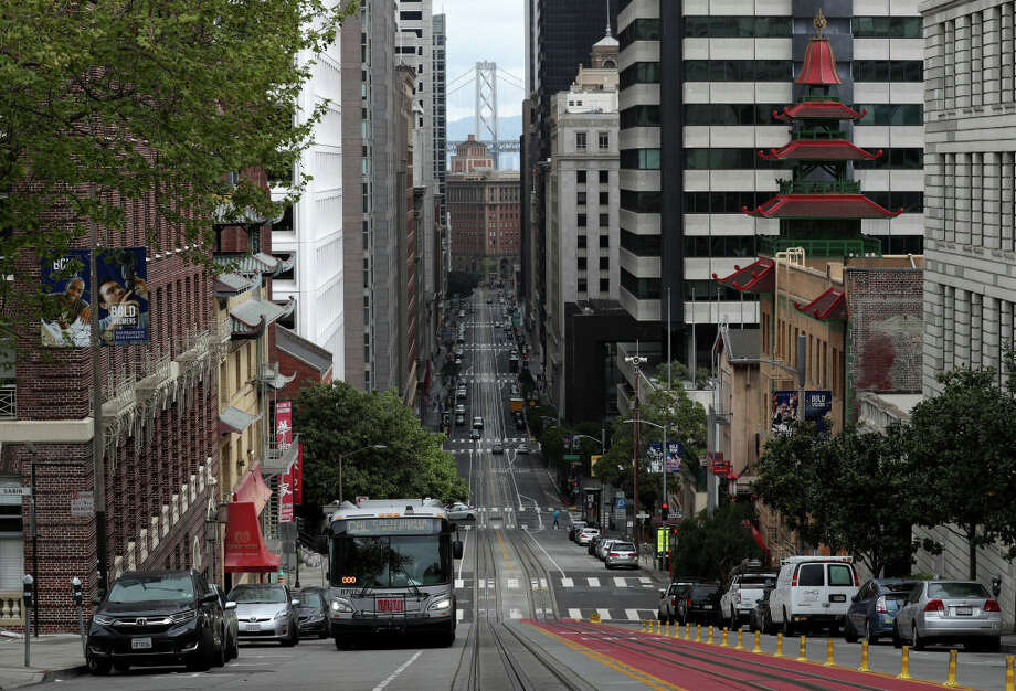 FILE.- A San Francisco MUNI bus travels along an empty California Street during the coronavirus (COVID-19) pandemic on April 6, 2020. Shortly after the SFMTA announced they would no longer transport police officers to protests, the SFPOA lashed back on social media. Photo: Justin Sullivan/Getty Images / 2020 Getty Images