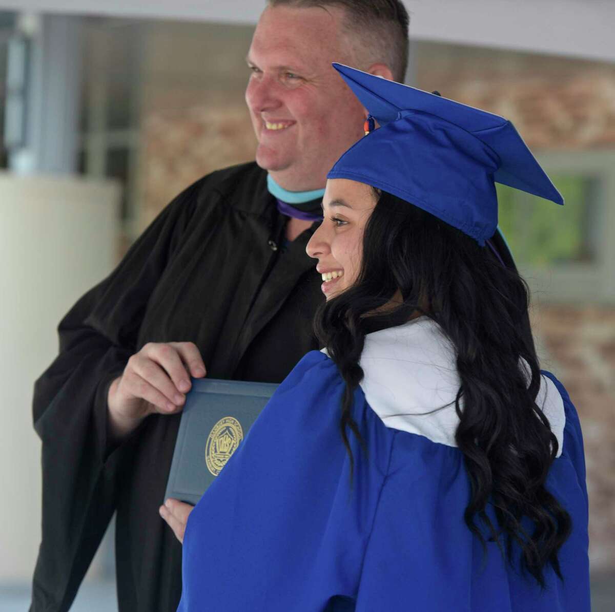 Principal Daniel Donovan posses for a photograph with graduate Aaliyah Jade Alonso during the 2020 Danbury High School graduation, Wednesday, June 10, 2020, at Danbury High School, Danbury, Conn. Graduation is taking place over three days, June 10, 11, and 12.