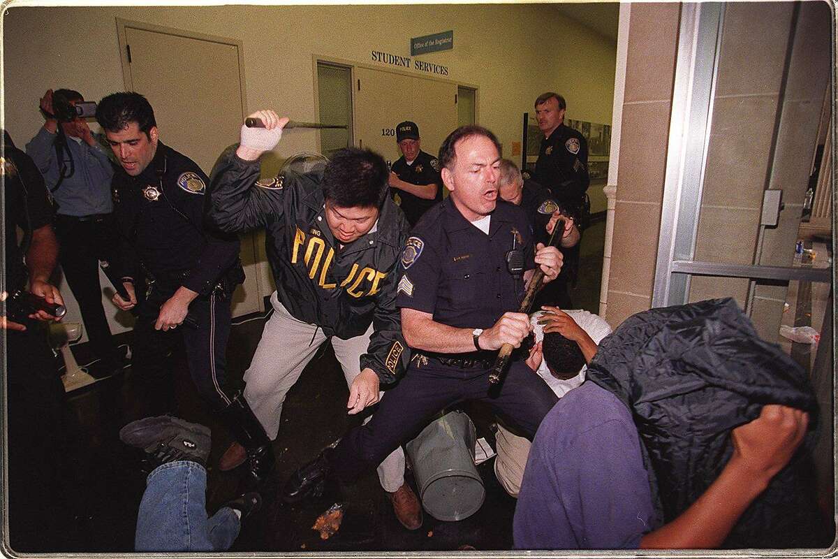 PROTEST 3/C/28APR97/CD/LS----Campus police beat on Prop 209 protesters after they had tried to take over Sproul Hall. Photo By Lea Suzuki