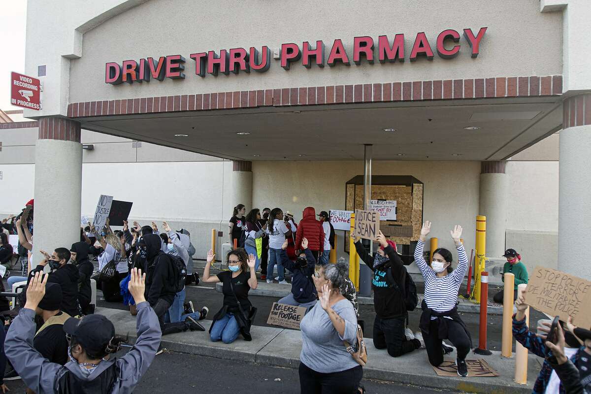 A group of protesters at the Walgreens where Sean Monterrosa was shot and killed by a Vallejo police officer earlier in the week in Vallejo, Calif., Friday, June 5, 2020