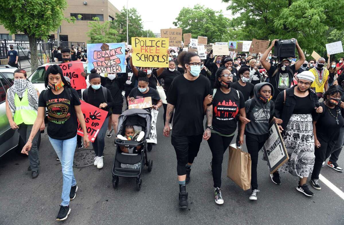 Members of the Citywide Youth Coalition lead a march protesting police brutality and the killing of George Floyd, organized with Black Lives Matter New Haven, down State Street in New Haven to the New Haven Police Department on June 5, 2020.