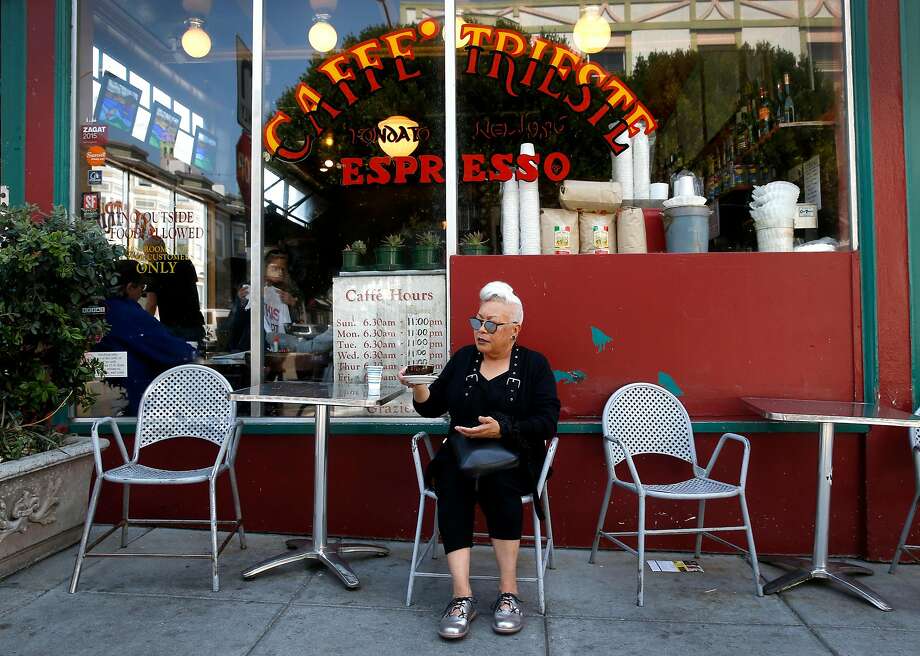 Paulette Baker, a longtime regular of Caffe Trieste, enjoys an Americano espresso in 2017. Photo: Paul Chinn / The Chronicle 2017