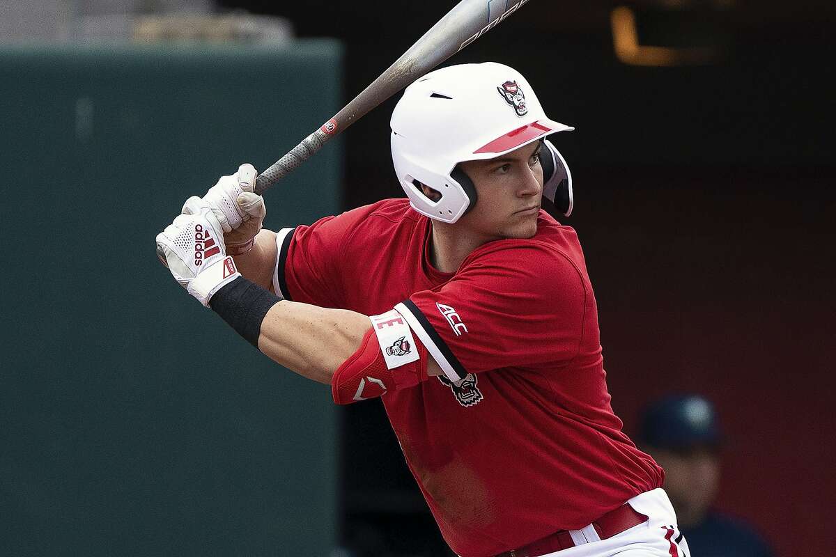 FILE - In this Feb. 25, 2020, file photo, North Carolina State's Patrick Bailey (5) bats during an NCAA baseball game on in Raleigh, N.C. Bailey is expected to be an early selection in the Major League Baseball draft. (AP Photo/Ben McKeown, File)
