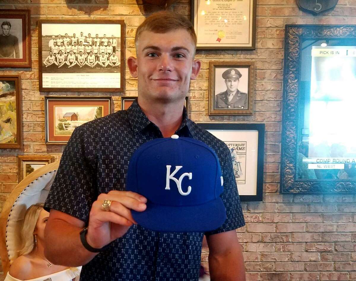 Texas A&M lefthander Asa Lacy, who was at a Bryan hotel during the MLB draft Wednesday night, had a Royals cap at the ready when he was selected fourth overall by Kansas City.