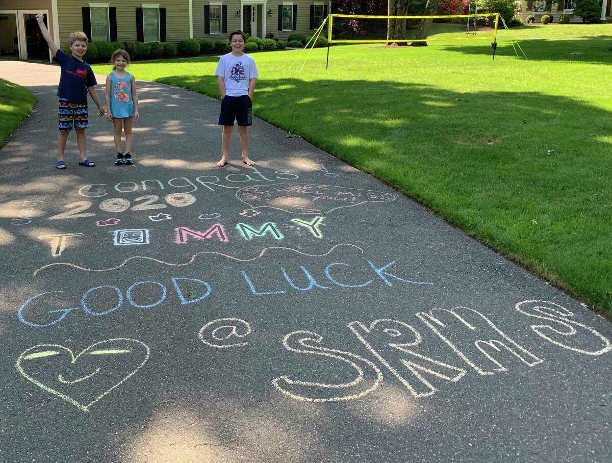 Scotland Elementary students Aiden and Abigail A. decorated 5th grader Tommy L's driveway wishing him well as he moves up to middle school.