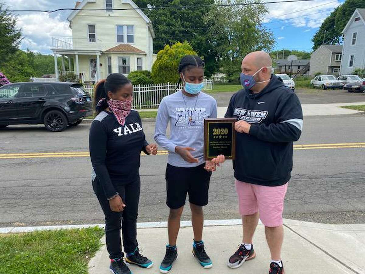 New Haven citywide athletic director Erik Patchkofsky hands out the city’s Female Athlete of the Year to Hillhouse’s Keyshan Johnson, center, on June 1, 2020. At left is Keyshan’s mother Tomeka.