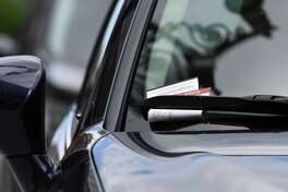 Parking tickets are issued on State Street near the Capitol on Thursday, June 11, 2020, in Albany, N.Y. The City of Albany resumed enforcement of metered street parking this week after the Capital Region entered phase two of the state's coronavirus reopening plan. (Will Waldron/Times Union)