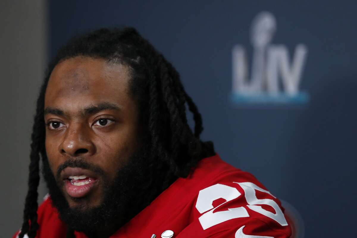 FILE - In this Jan. 30, 2020 file photo San Francisco 49ers cornerback Richard Sherman speaks during a media availability in Miami, for the NFL Super Bowl 54 football game against the Kansas City Chiefs. Sherman is calling on the NFL to go beyond commissioner Roger Goodell's statement condemning racism. Sherman said, Wednesday, June 10, 2020, the league needs to do a better job hiring minorities in coaching and front office positions and also be vigilant about calling out racism whenever it arises. (AP Photo/Wilfredo Lee, file)