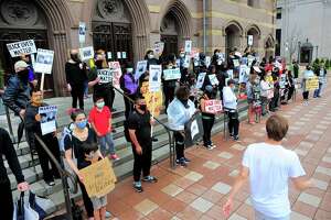 Over 50 people with Unidad Latina en Accion hold a black-brown unity march to protest police brutality against black people and Latinos in New Haven on Thursday, June 11.