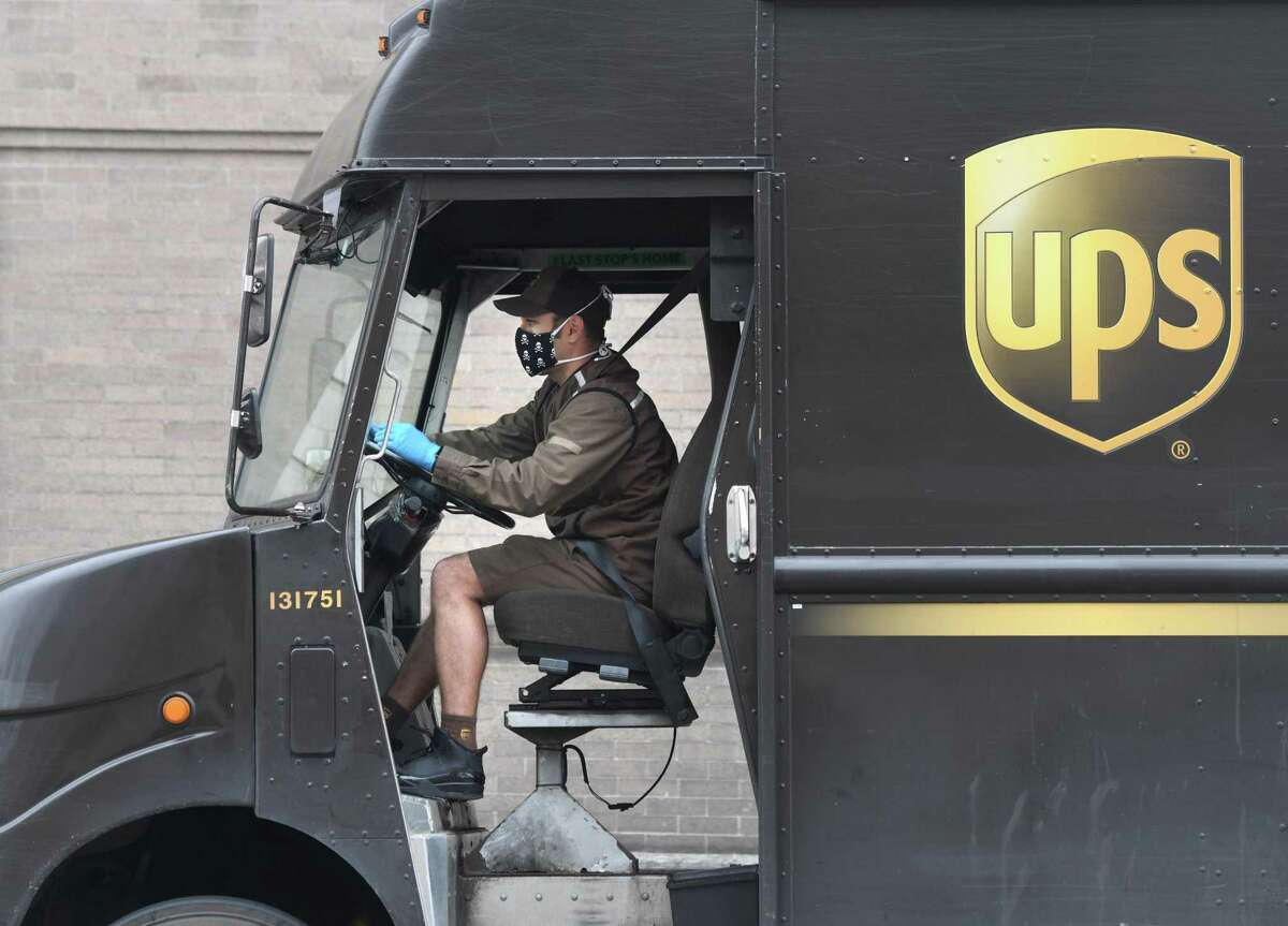 A UPS driver in April 2020 during the coronavirus pandemic, while making the rounds in Greenwich, Conn.
