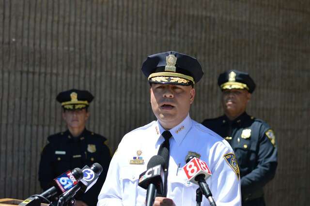 New Haven Police Chief Otoniel Reyes, center