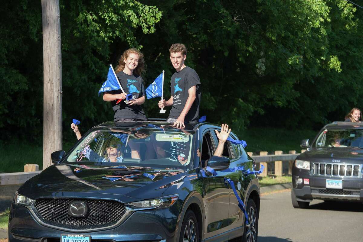 Shannon and Liam Flaherty. Darien High held a wave-through graduation car parade for the Class of 2020 seniors on the morning of June 12, after postponing it due to weather from June 11.