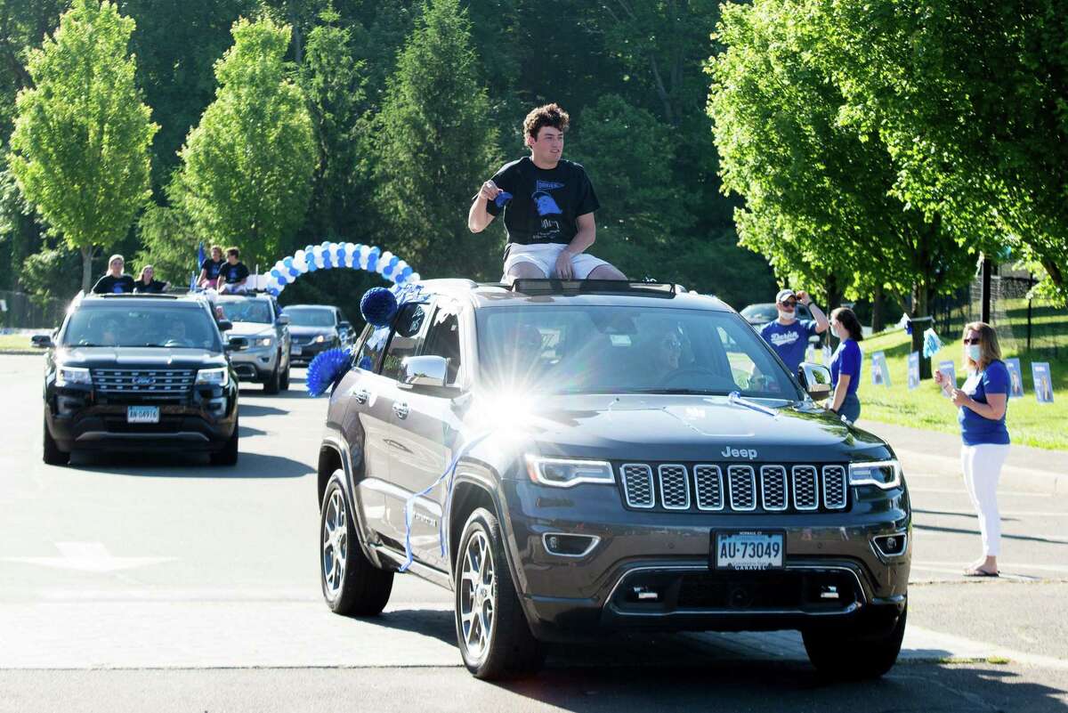 Ethan Haas. Darien High held a wave-through graduation car parade for the Class of 2020 seniors on the morning of June 12, after postponing it due to weather from June 11.