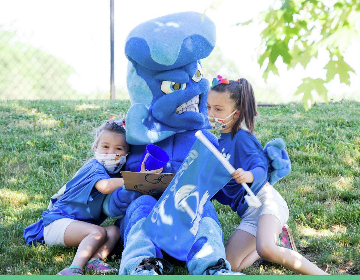 The Blue Wave mascot. Darien High held a wave-through graduation car parade for the Class of 2020 seniors on the morning of June 12, after postponing it due to weather from June 11.
