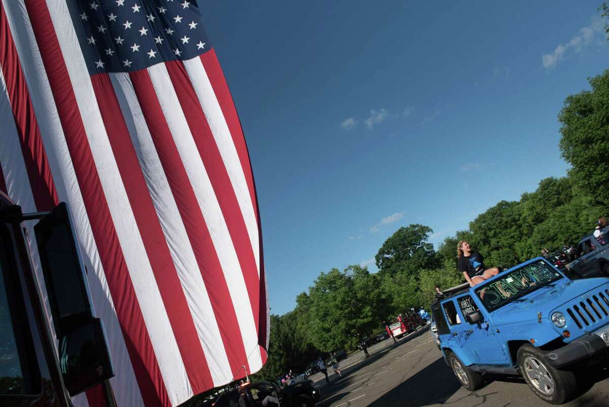 Darien High held a wave-through graduation car parade for the Class of 2020 seniors on the morning of June 12, after postponing it due to weather from June 11.