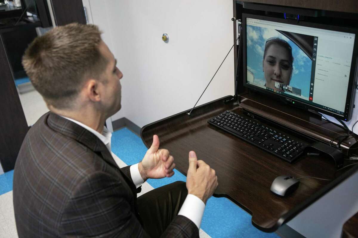 Dr. Matthew Harting speaks to his patient's mother Kathleen Clark during a telemedicine appointment at UT Physicians on June 08, 2020.