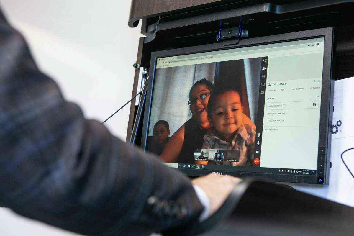 Chelsea Garcia discusses her son's post-surgery progress with Dr. Matthew Harting during a telemedicine video call at UT Physicians on June 08, 2020.