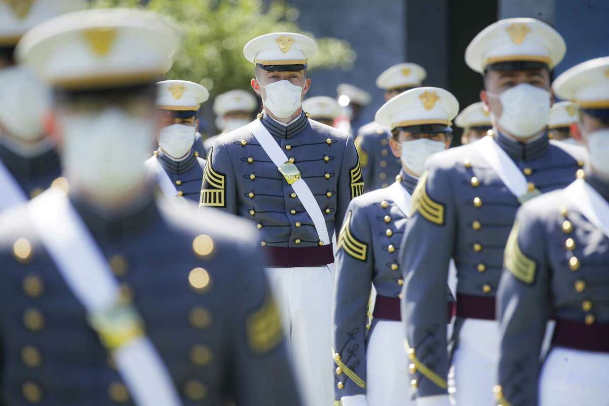 WEST POINT, NY - JUNE 13: West Point graduating cadets wear personal protective equipment as they gather at their seats during commencement ceremonies at Plain Parade Field at the United States Military Academy on June 13, 2020 in West Point, New York. U.S. President Donald Trump addressed the graduating class of 1,107 cadets during a socially-distanced ceremony held amid the COVID-19 pandemic. (Photo by John Minchillo-Pool/Getty Images)