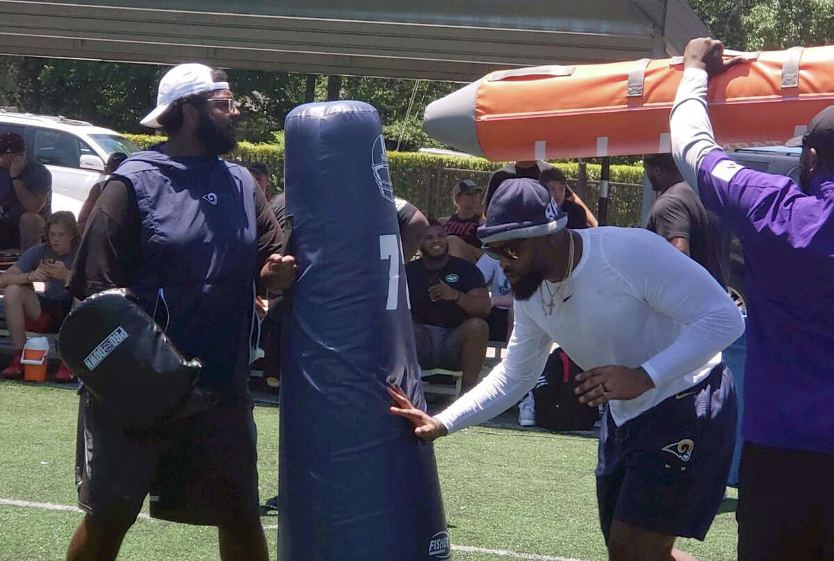Rams defensive end Michael Brockers works on drills with private coach Brandon Jordan in Tomball.