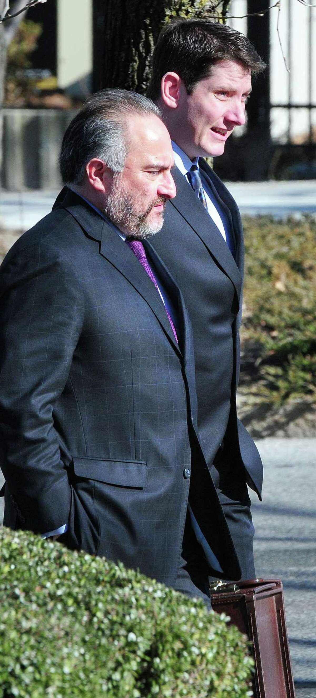 Former East Haven Police Officer David Cari (right) walks into Federal Court in Bridgeport with his attorney Alex V. Hernandez (left) on 1/24/2013. Photo by Arnold Gold/New Haven Register AG0481E