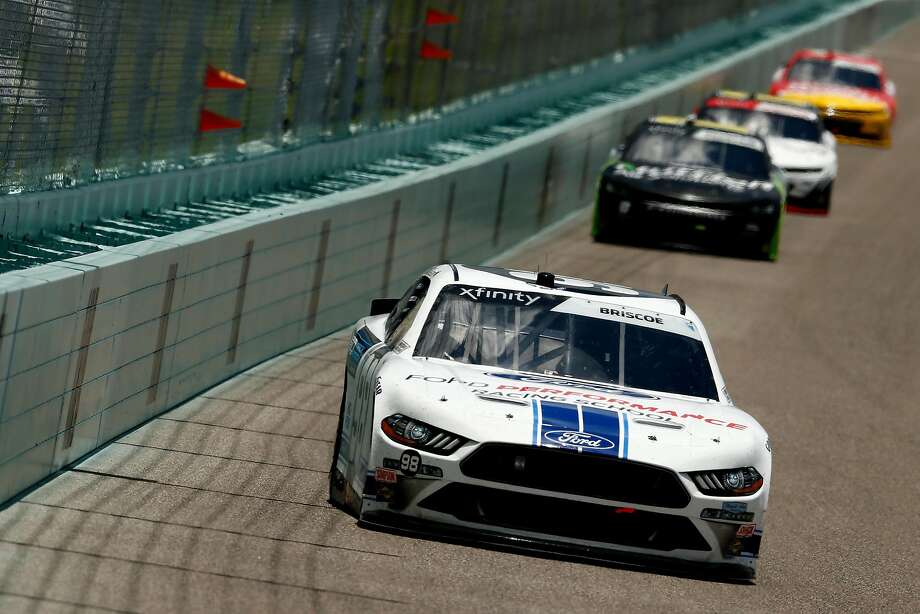 Chase Briscoe leads a pack of cars during the NASCAR Xfinity Series Contender Boats 250 at Homestead-Miami Speedway. Briscoe survived two late cautions and a frantic overtime finish to prevail. Photo: Michael Reaves / Getty Images