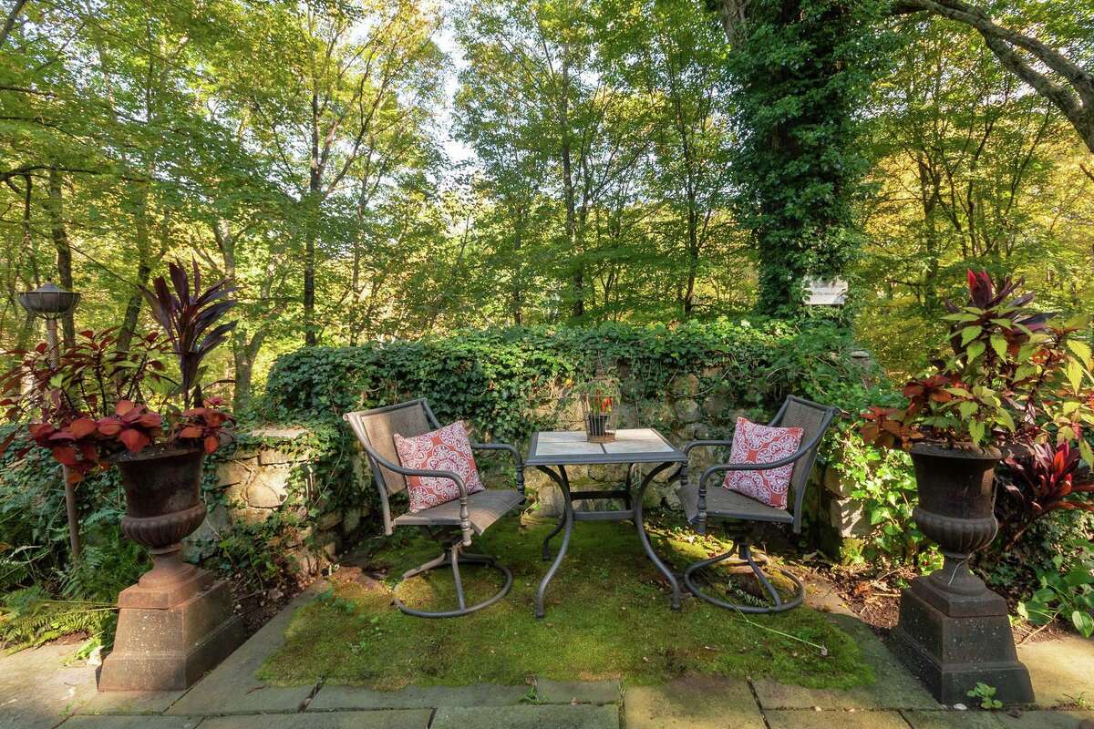 The attractive grounds features attractive landscaping and outdoor