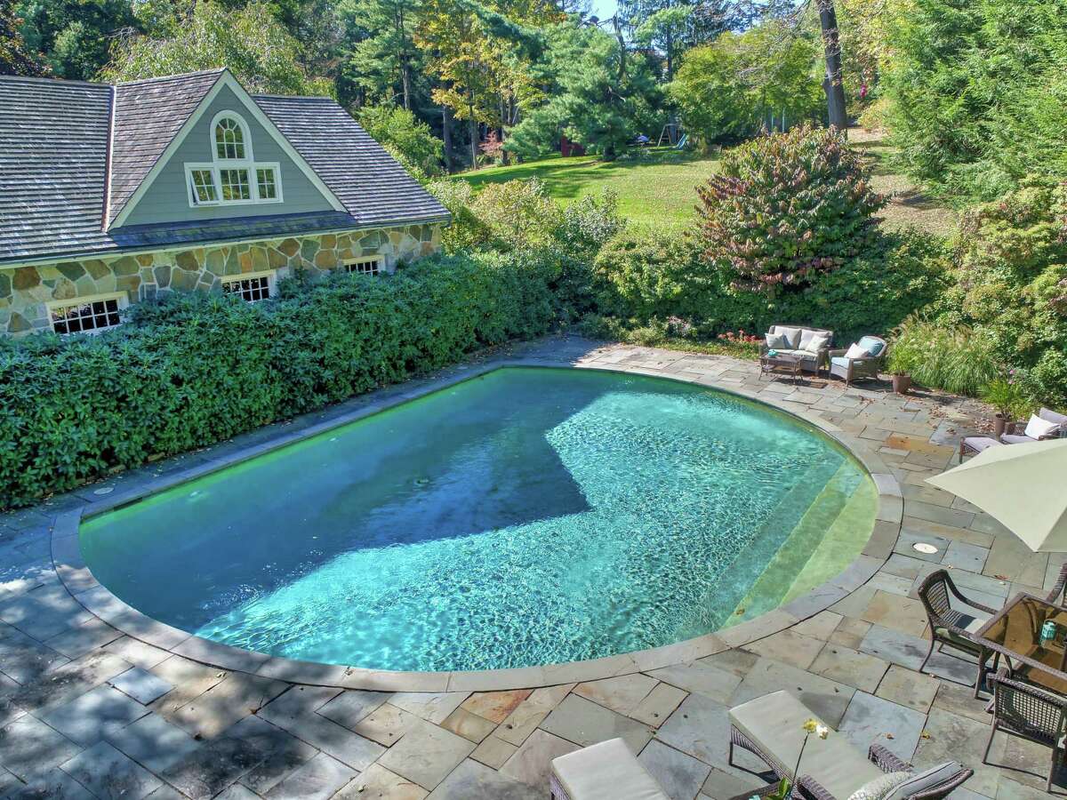 This 4.92-acre level and gated property features a heated Gunite Wagner circular in-ground swimming pool. The current owners have restored much of the landscape to its original grandeur, adding to old-growth trees more than an acre of new lawn, specimen plantings and perennial gardens including over two hundred irises and day-lilies, all protected by an impenetrable barrier of custom deer fencing.