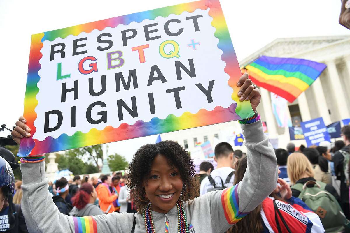 (FILES) In this file photo taken on October 08, 2019 Demonstrators in favour of LGBT rights rally outside the US Supreme Court in Washington, DC, as the Court holds oral arguments in three cases dealing with workplace discrimination based on sexual orientation. - The US Supreme Court ruled June 15, 2020 that federal protections against workplace discrimination apply equally to sexual orientation, contrary to the position taken by the administration of President Donald Trump. (Photo by SAUL LOEB / AFP) (Photo by SAUL LOEB/AFP via Getty Images)