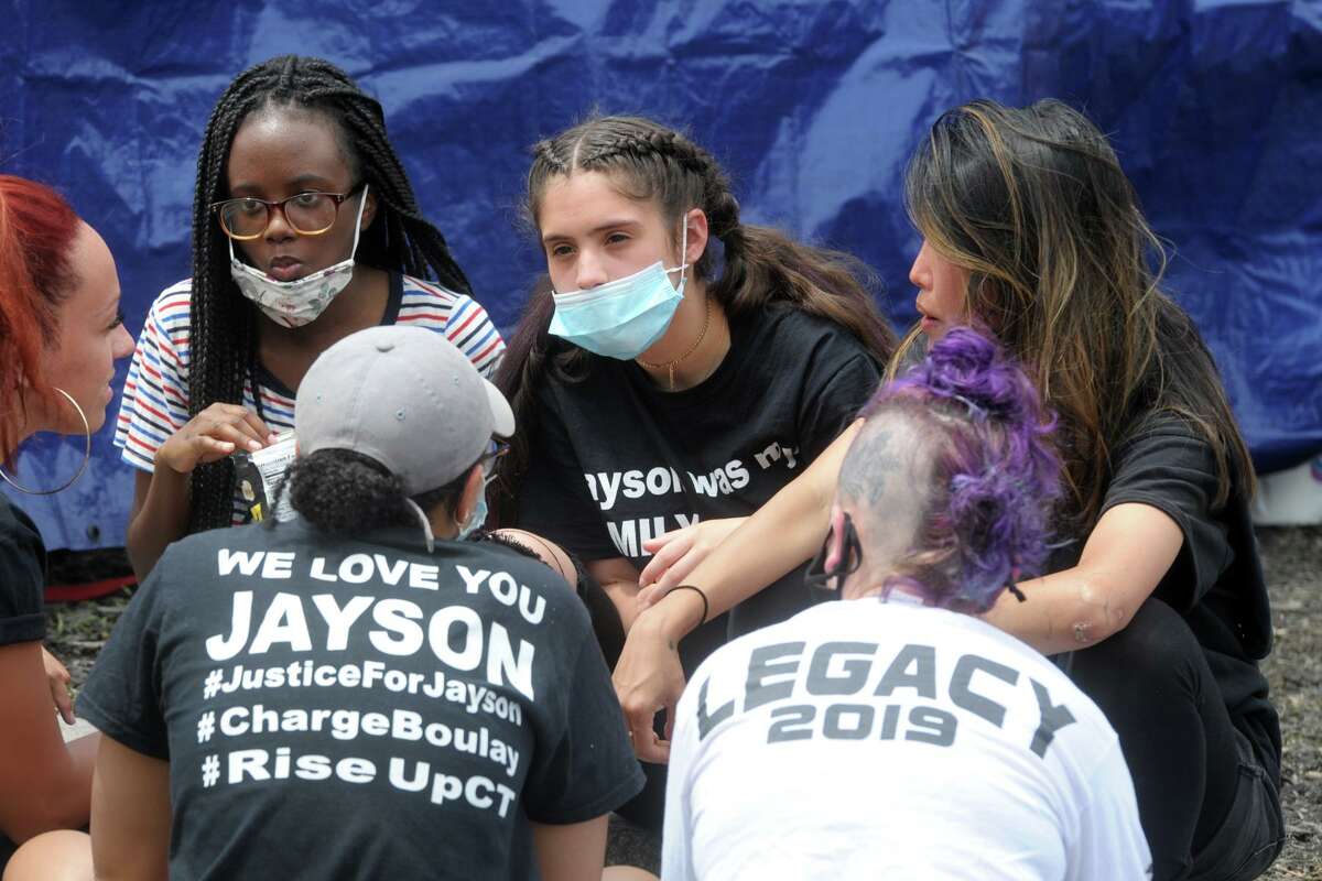 Jazmarie Melendez, sister of Jayson Nagron, talks with other protesters camped out in front of Police Headquarters, in Bridgeport, Conn. June 15, 2020. This Justice for Jayson protest is being staged to demand action drom city police and government officials following the death of Nagron, who was shot and killed by Bridgeport police following an automobile chase in 2017.