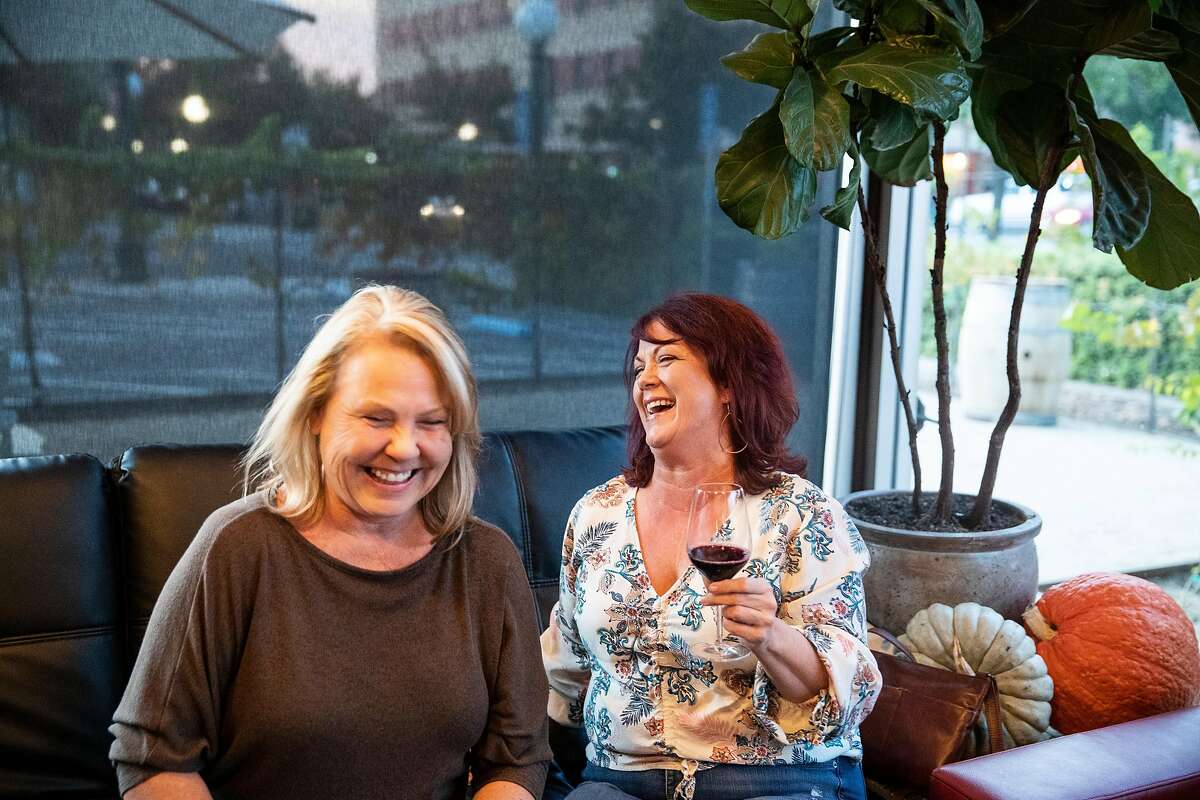 Lisa Wade (left) and Cheryl Albers enjoy a glass of wine while visiting McCay Cellars in Lodi, Calif., on Thursday, October 10, 2019. The winery tasting room is located in downtown Lodi.