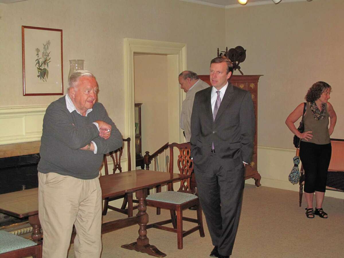 U.S. Senator Chris Murphy for Connecticut, talks with former longtime New Canaan Advertiser Editor Ed Chrostowski at a past Advertiser coffee. Murphy was given a tour of the New Canaan Museum and Historical Society, and a primer on the town's history during his visit to the coffee. Word has been received of the death of Chrostowski. Chrostowski was the editor of the Advertiser, a weekly newspaper, for some five decades.