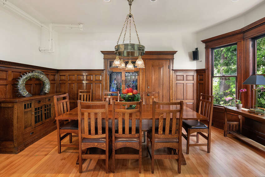 Original built-ins still stand ready to hold everything you need to serve dinner in this formal dining room.