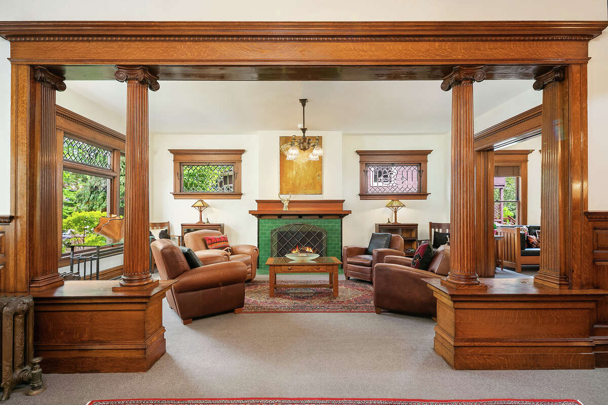 In the main living area, a fireplace and beveled glass create warmth and light.