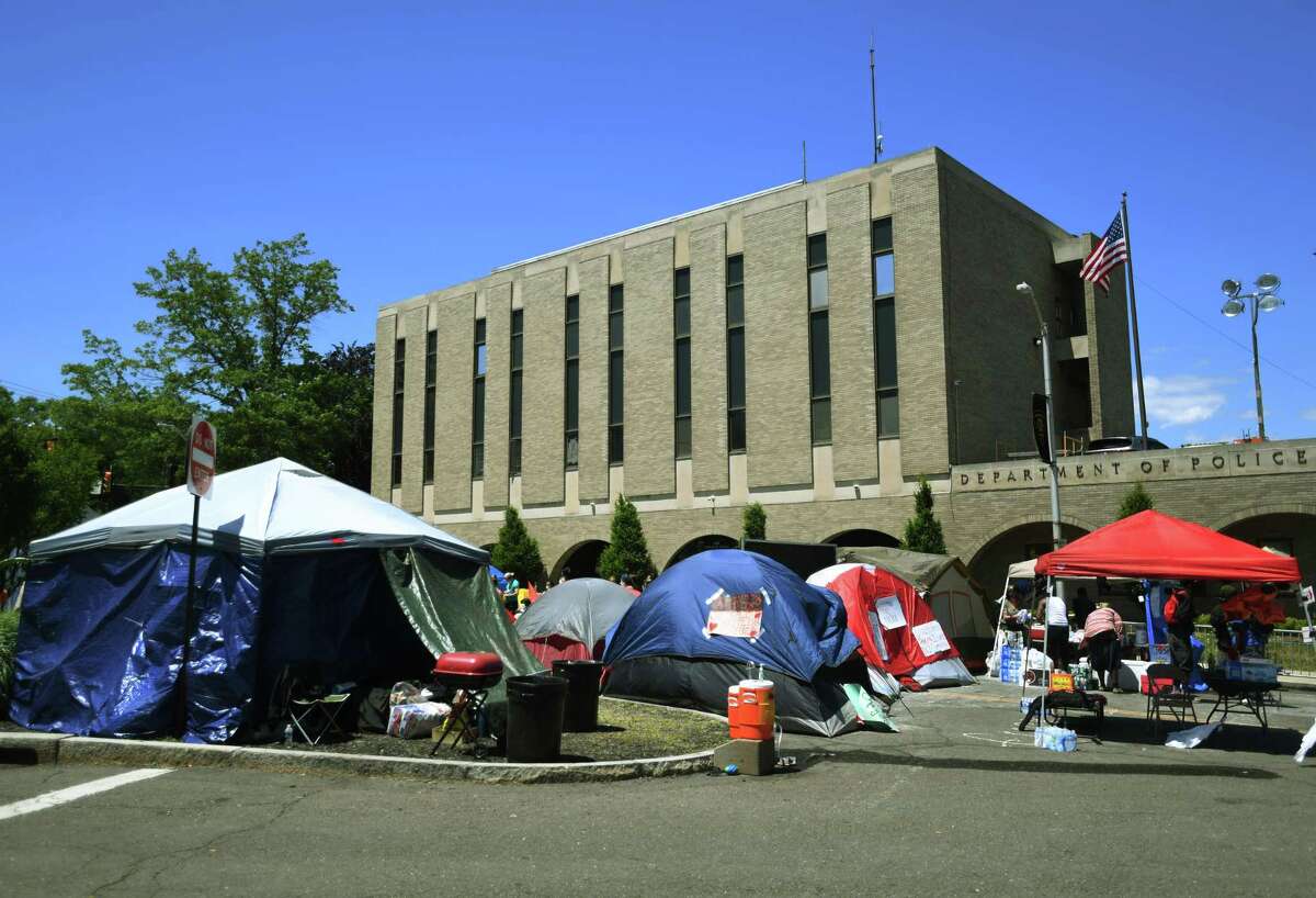 Protestors settle in for a fifth consecutive day at their encampment outside Bridgeport Police Headquarters in Bridgeport, Conn. on Monday, June 15, 2020. The protestors have asked to publicly air their demands in front of the Bridgeport City Council.