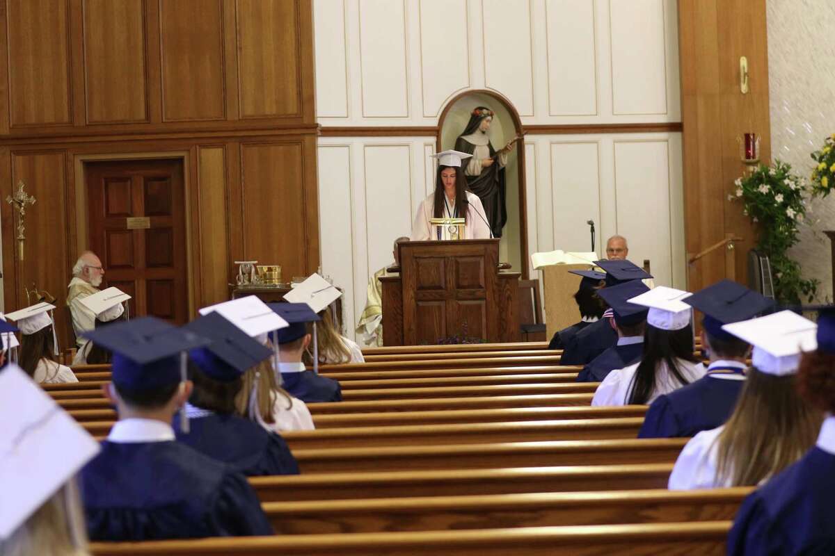 Mackenzie O'Rourke, of Brookfield, addressing her classmates at the podium at Immaculate High School’s graduation on Saturday, June 13 at St Rose of Lima Church in Newtown.
