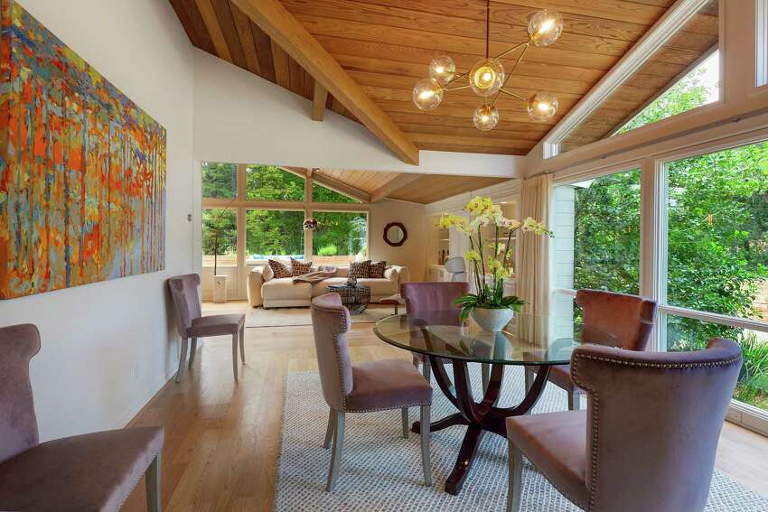 An open floor plan leads to a formal dining room, connected to the kitchen through a butler's pantry with ample storage.