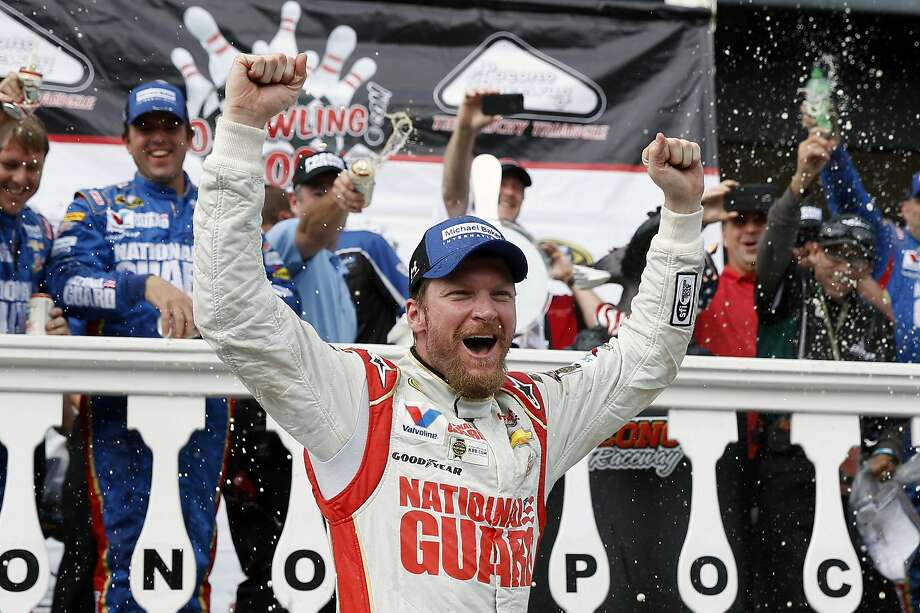 FILE - In this Aug. 3, 2014, file photo, Dale Earnhardt Jr. celebrates in Victory Lane after winning a NASCAR Sprint Cup Series auto race at Pocono Raceway in Long Pond, Pa. Longtime fan favorite Dale Earnhardt Jr. is expected to be the marquee name on NASCAR's 2021 Hall of Fame class, to be announced Tuesday, June 16, 2020. (AP Photo/Matt Slocum, File) Photo: Matt Slocum / Associated Press