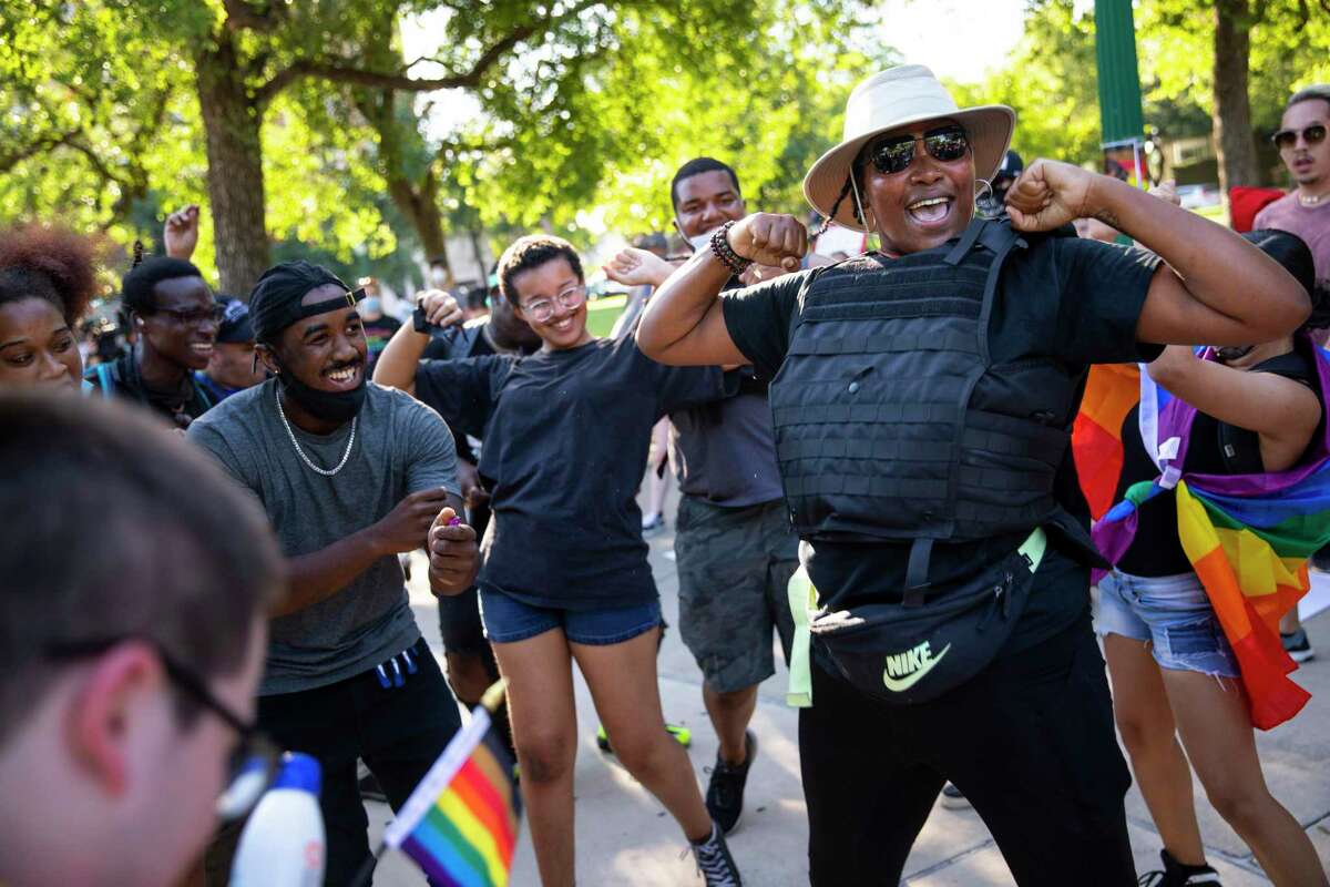 Jourdyn ?’Mamma Jo,?“ Parks, right, dances as the march reaches Crockett Park during the Queer Black Lives Matter protest and march in San Antonio, Texas, U.S. on Saturday, June 13, 2020.