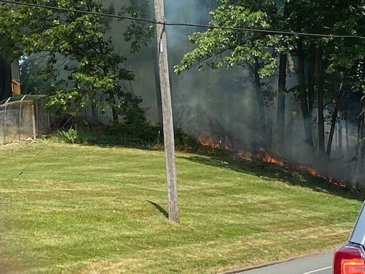 Firefighters responded to a fire that temporarily stopped traffic on Trap Falls Road.