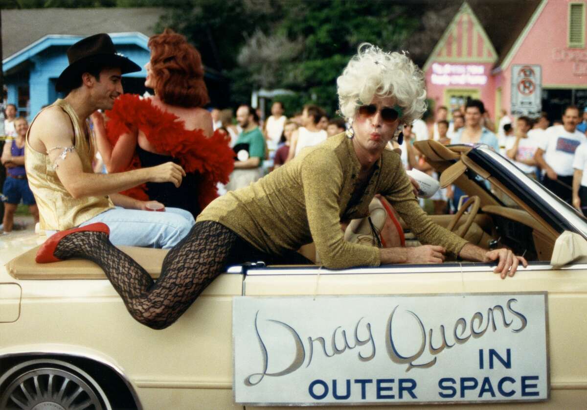A little over 100 people marched down Westheimer during Houston's first Pride, which was at the time called the Houston Gay and Lesbian Pride Parade, in 1976.  Original caption: Bob Pine makes his way down Westheimer as a "Drag Queen in Outer Space" during the 1991 Gay Pride Parade in Houston.