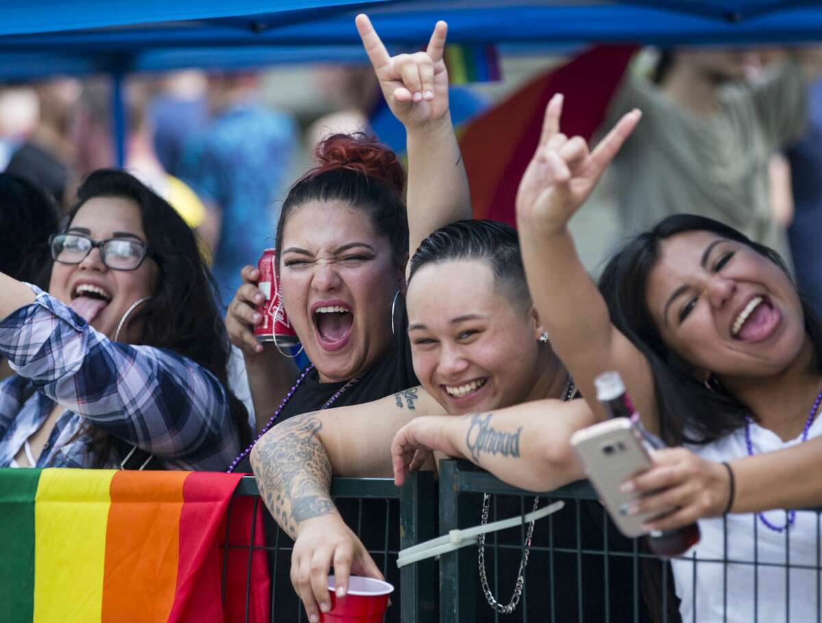 Parade goers cheer as they watch the annual Pride Parade on Saturday, June 24, 2017, in Houston. ( Brett Coomer / Houston Chronicle )