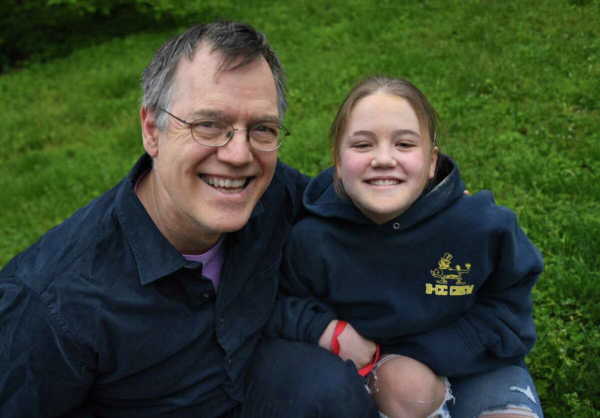Tom Schruben and his daughter Darcy pose in Kensington, Md., on May 1, 2020.