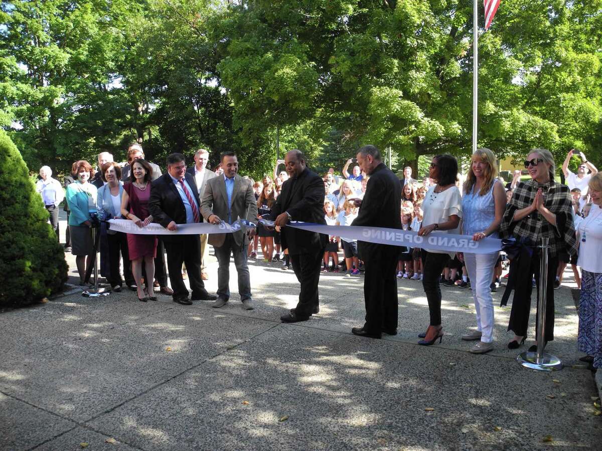 Our Lady of Fatima became a Catholic academy last year when Father Reggie Norman, pastor of Our Lady of Fatima Church, cut the ribbon accompanied by Kevin Vallerie, president of Our Lady of Fatima's school board, and Bishop Frank Caggiano of the Diocese of Bridgeport. The school was in danger of closing until a successful fundraising drive last week.